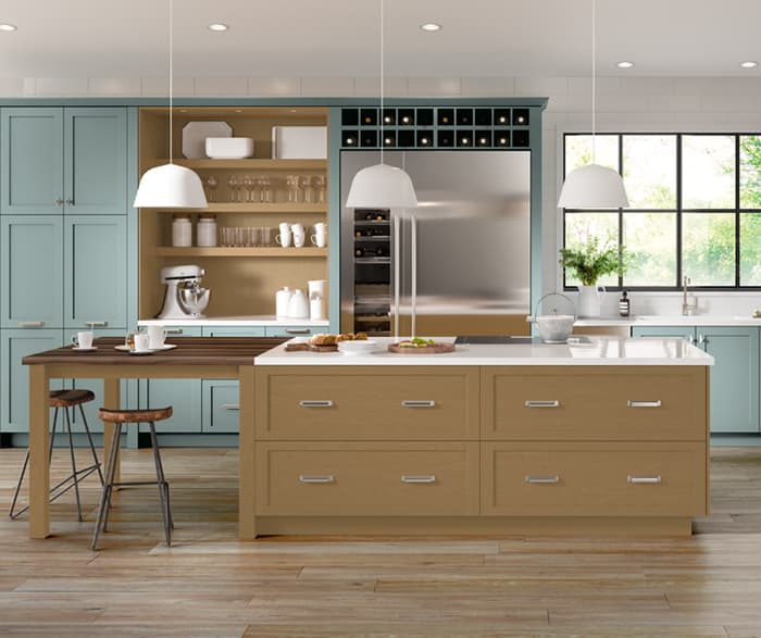Kitchen Craft Gentry frameless cabinetry with walnut island and sage green cabinets
